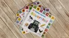 A stack of children's books about a farm, laid out on a wooden surface. Produktbild-Vorschau