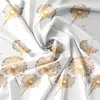A pattern of dandelions on a white, wrinkled fabric. Podgląd zdjęcia produktu