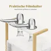 Two silver hairdryers are placed in holders on a white and gold shelf unit. Produktbild-Vorschau