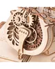 A close-up view of the intricate wooden gears and mechanisms of a mechanical cello model. Náhľad obrázku produktu