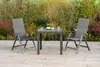 A garden furniture set consisting of a table and two chairs, placed on a patio with a garden in the background. Produktbild-Vorschau