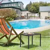 A backyard scene with a swimming pool, lounge chair, and a small table with a book and cup. Produktbild-Vorschau