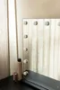 A vanity mirror with lights and some makeup products on a table. Produktbild-Vorschau