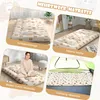 A collage of images showing a foldable mattress in different settings: as a sleeping mat, a tatami mat, a floor futon mattress with a person, and a camping mattress inside a tent. The mattress has a cute bear pattern. Produktbild-Vorschau