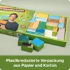 A green box containing an advent calendar with many small boxes inside, some are outside the box. A man is pictured on the lid of the box. Produktbild-Vorschau