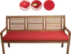 A red cushion on a wooden garden bench. Produktbild-Vorschau
