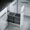 A pull-out kitchen bin system with two dark gray bins is shown in a modern kitchen setting. Produktbild-Vorschau