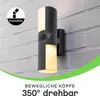A black and white outdoor wall lamp mounted on a brick wall. Anteprima dell’immagine prodotto