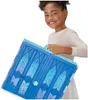 A young girl is holding a blue toy castle. Náhľad obrázku produktu