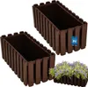 Two brown rectangular planters are shown against a white background, with one planter in the foreground and the other slightly behind and to the left. A small bunch of purple flowers is planted in the foreground planter. Produktbild-Vorschau