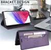 A desk with a laptop, phone, and other office items, with a phone case displayed prominently. Produktbild-Vorschau