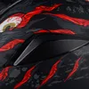 A close-up view of a motorcycle helmet with a graphic design. Produktbild-Vorschau
