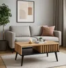 A coffee table in a living room setting, placed in front of a sofa. Podgląd zdjęcia produktu