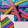 A collage of colorful pool noodles in water and arranged in a rainbow pattern. Produktbild-Vorschau