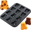 A baking pan with multiple bear-shaped molds and three baked bear-shaped cakes. Anteprima dell’immagine prodotto