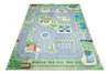 A colorful play mat depicting a city street scene with roads, buildings, a park, and a carousel. Produktbild-Vorschau