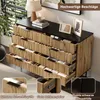 A sideboard with open drawers, showcasing its interior and hardware, in a room setting. Produktbild-Vorschau