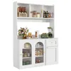A white kitchen hutch with glass doors, shelves, and a drawer, filled with kitchenware and decorative items. Náhľad obrázku produktu