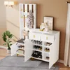 A white entryway furniture set with a coat rack, bench, and shoe cabinet, displayed in a room setting. Anteprima dell’immagine prodotto