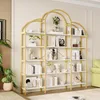 A modern bookshelf with gold accents and white shelves, filled with books and decorative items, is placed against a light-colored wall. Produktbild-Vorschau