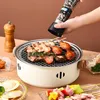 A hand is seasoning food on a portable grill. Anteprima dell’immagine prodotto