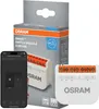A product box and its contents, including a smartphone displaying an app interface, a smart switch module, and the product packaging. Produktbild-Vorschau