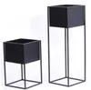 Two black metal plant stands of different heights against a white background. Produktbild-Vorschau