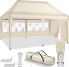 A beige pop-up canopy tent with three side walls, each featuring arched windows. Accessories like ropes, stakes, and a carrying bag are displayed in the foreground. Anteprima dell’immagine prodotto