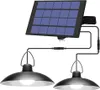 A solar-powered hanging light fixture with two lamps and a solar panel. Produktbild-Vorschau