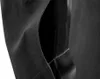 A close-up view of a black work overall pocket. Náhled obrázku produktu