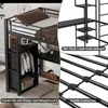 A loft bed with a desk and wardrobe, shown in a room setting with some decorative elements. Anteprima dell’immagine prodotto