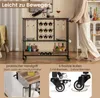 A person is pushing a bar cart in a room, with text overlays highlighting features. Podgląd zdjęcia produktu