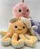 Three plush octopus toys stacked on top of each other against a white background. Produktbild-Vorschau