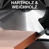 A close-up of a circular saw blade cutting a piece of wood. Produktbild-Vorschau