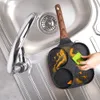 A person is cleaning a multi-compartment frying pan in a kitchen sink. Náhľad obrázku produktu