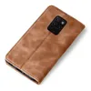 A brown leather flip cover for a smartphone is shown on a white background. Produktbild-Vorschau