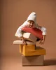 A child wearing a white beanie and shirt is playing with colorful foam blocks, climbing on them and holding them. Anteprima dell’immagine prodotto