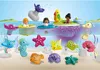A collection of PLAYMOBIL figures and bath toys in a water setting. Náhľad obrázku produktu