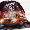 A red Volkswagen Golf GTI is depicted in a dynamic, street-themed scene, with a duvet cover featuring the car and the Volkswagen logo. Produktbild-Vorschau