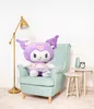 A large purple plush toy sits in a light blue armchair next to a floor lamp and small side tables. Náhled obrázku produktu