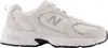 A side view of a New Balance 530 lifestyle sneaker in beige. Produktbild-Vorschau