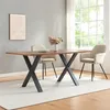 A dining room scene with a table and chairs. Voir les images du produit