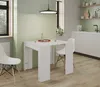 A modern dining area with a white extendable table and chairs. Náhled obrázku produktu