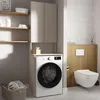 A laundry room with a washing machine, cabinets, and a toilet. Náhľad obrázku produktu