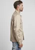 A man is shown from the side wearing a beige shirt. Anteprima dell’immagine prodotto