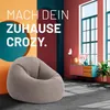 A beanbag chair is placed in a stylishly decorated room with colorful walls and a cabinet with decorative items. Anteprima dell’immagine prodotto