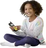 A young girl is sitting on the floor, holding and interacting with a walkie-talkie. Produktbild-Vorschau