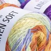 A close-up view of several spools of yarn, with labels indicating the brand and type of yarn. Produktbild-Vorschau