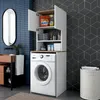 A laundry room with a washing machine and a cabinet above it, a mirror on the wall, and a laundry basket. Voir les images du produit