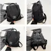 Vierfeld-Collage mit einem schwarzen Rucksack von vorne, Seite und hinten, mit silbernem Logo Produktbild-Vorschau